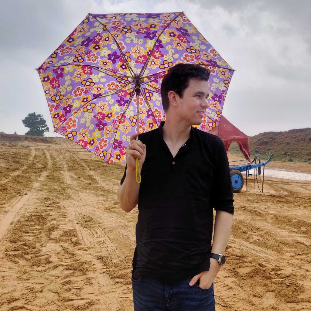 Thomas in India with umbrella
